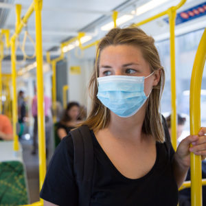 Women in mask on public transportation